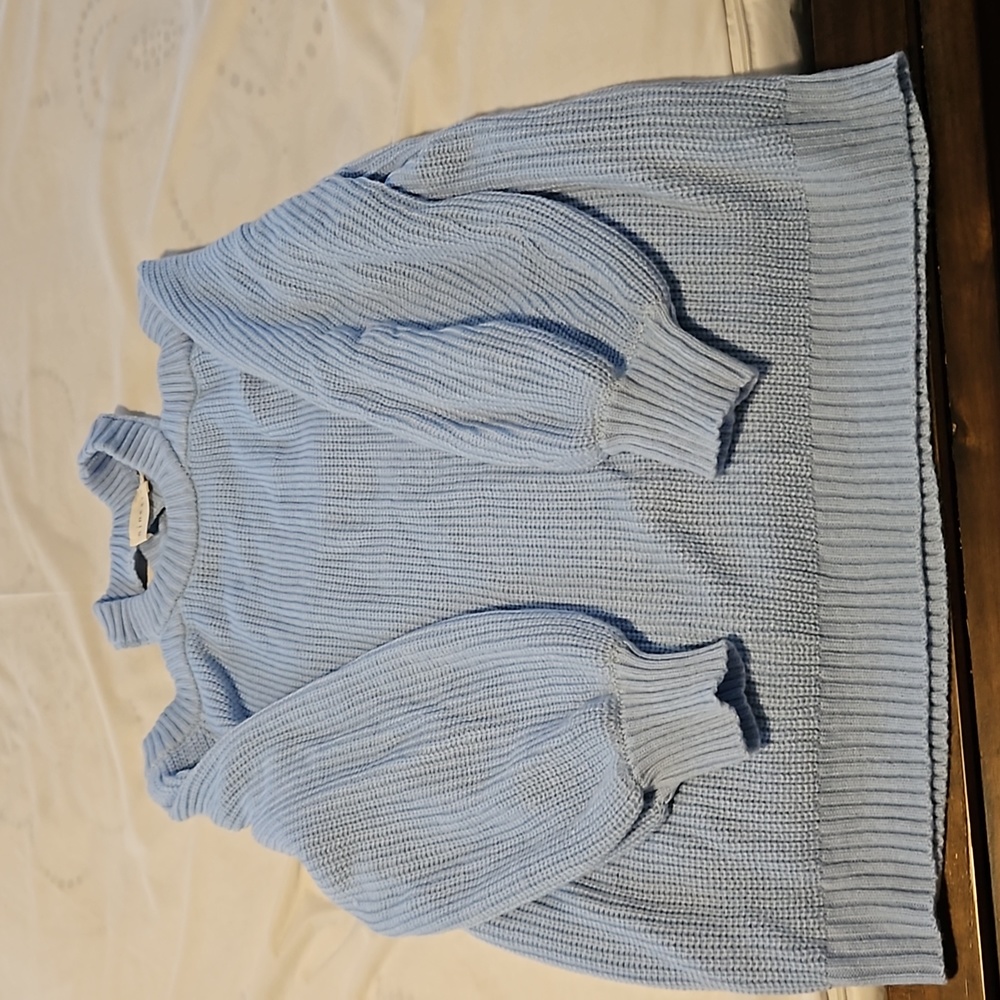 Sweater is a medium but fits like a large